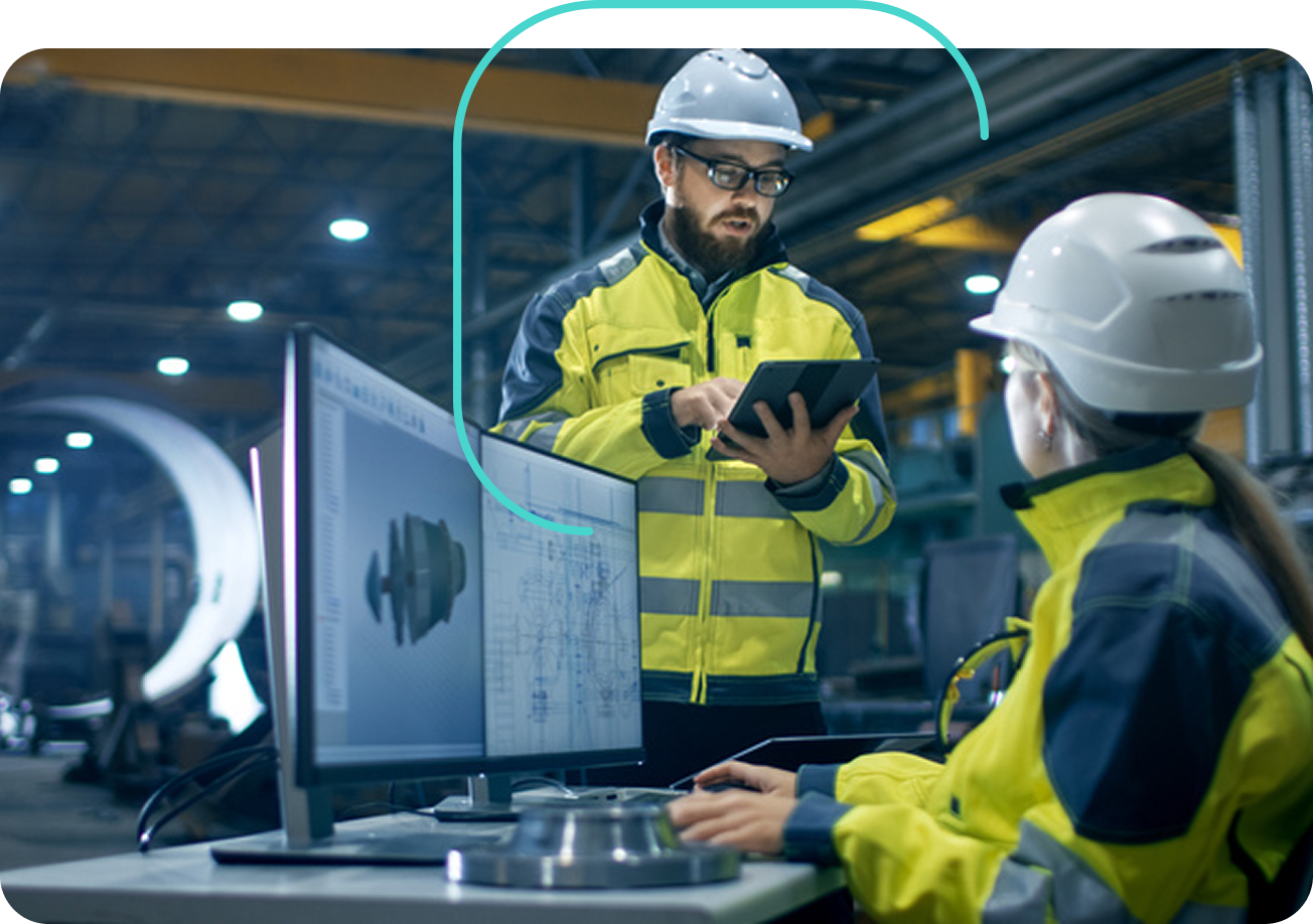 Two plant staff working with AI tools